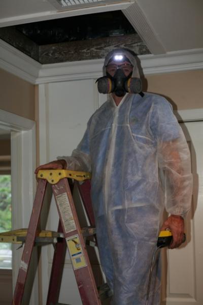 An Energy Doctor preparing to inspect an attic