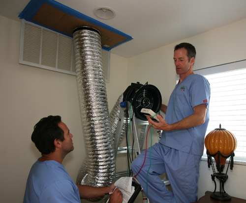 The Build Doctor's team performing a Duct Blaster test at a job site